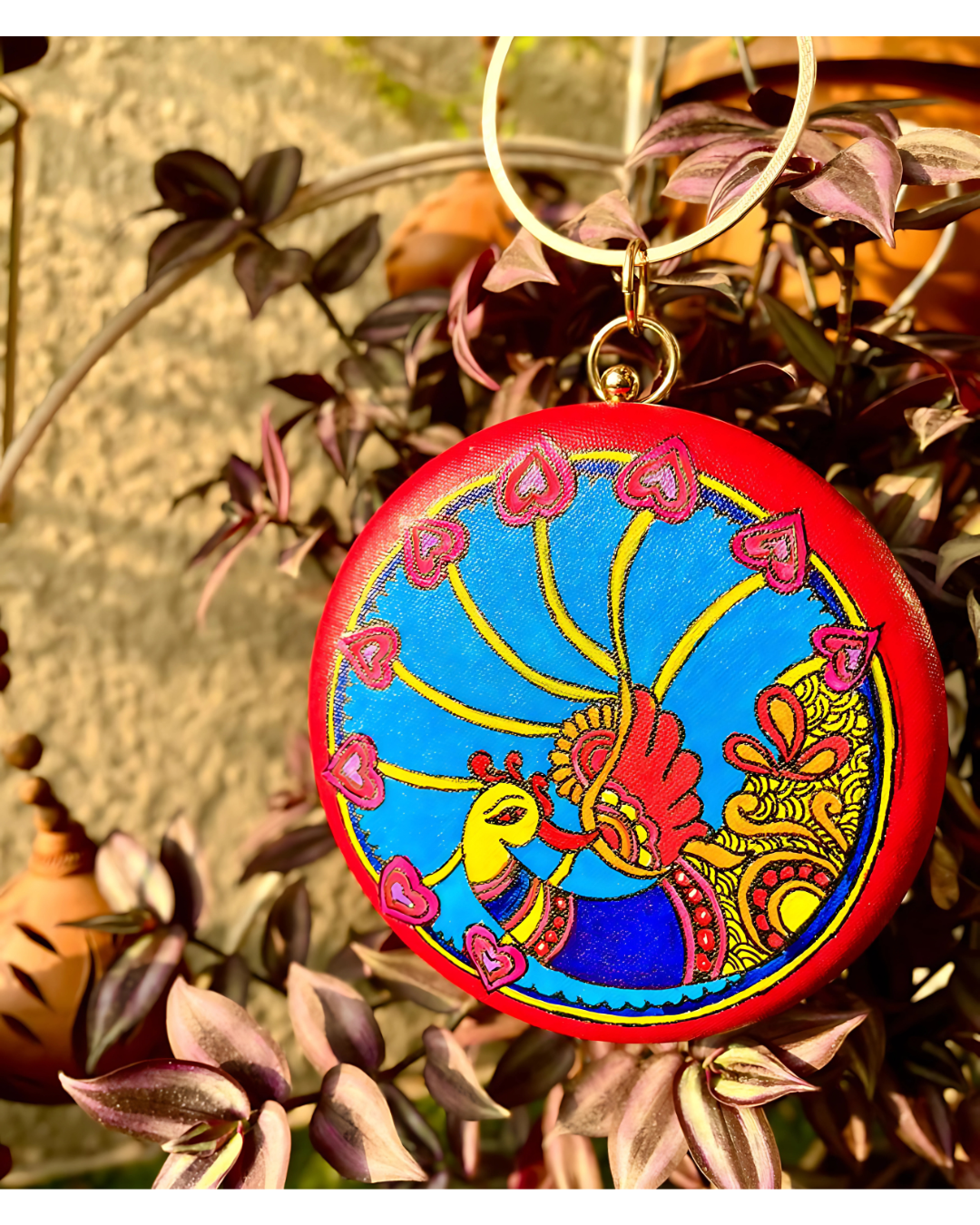 Peacock & Fish Symphony – Hand painted Madhubani Round Clutch
